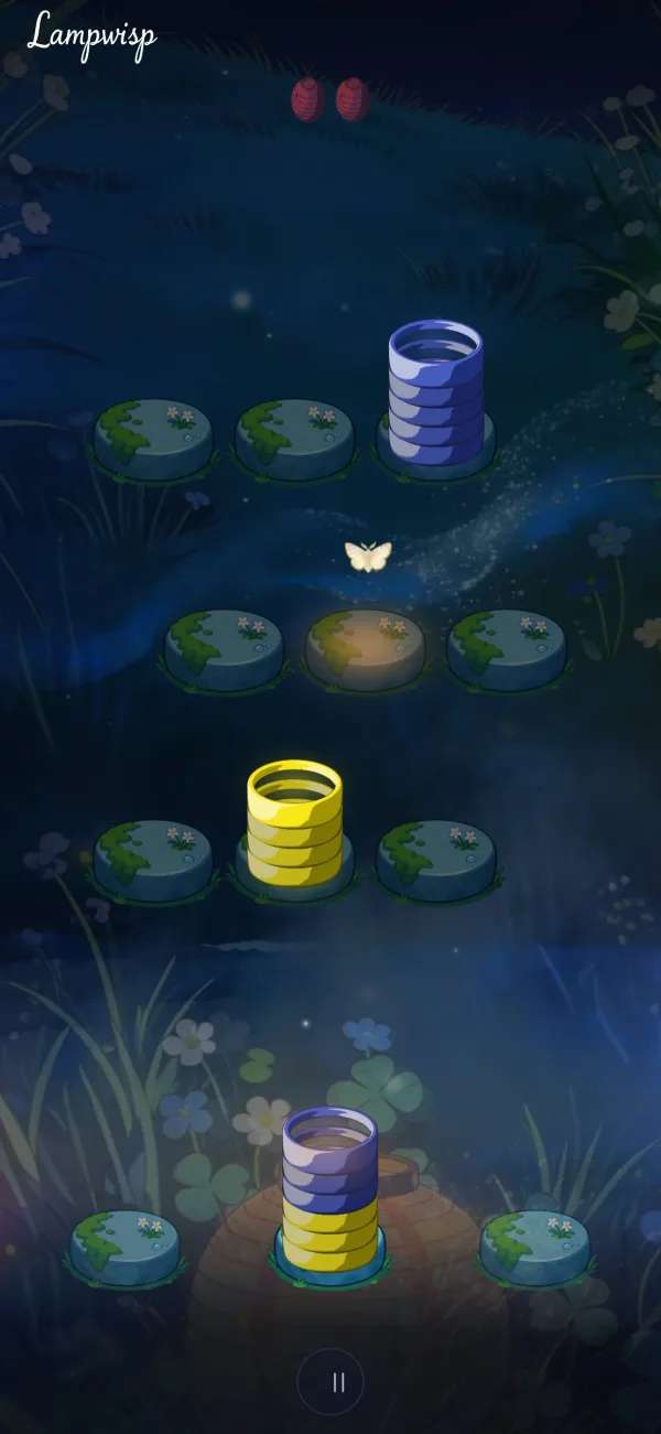 A night in the Meadow: stacks of paper rings on mossy stones, a paper lantern glowing below